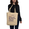 Read the Minutes tote with the Kitty masthead, carried on the shoulder